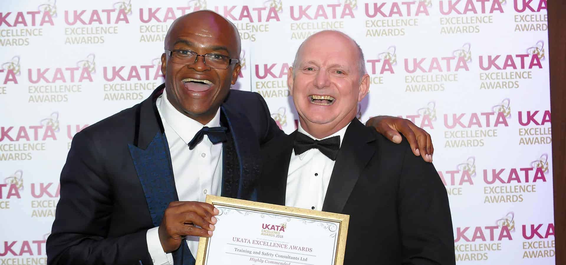 TASC UKATA award win with Chris Akabusi